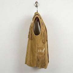 Side profile of men's tan suede fringe western vest.