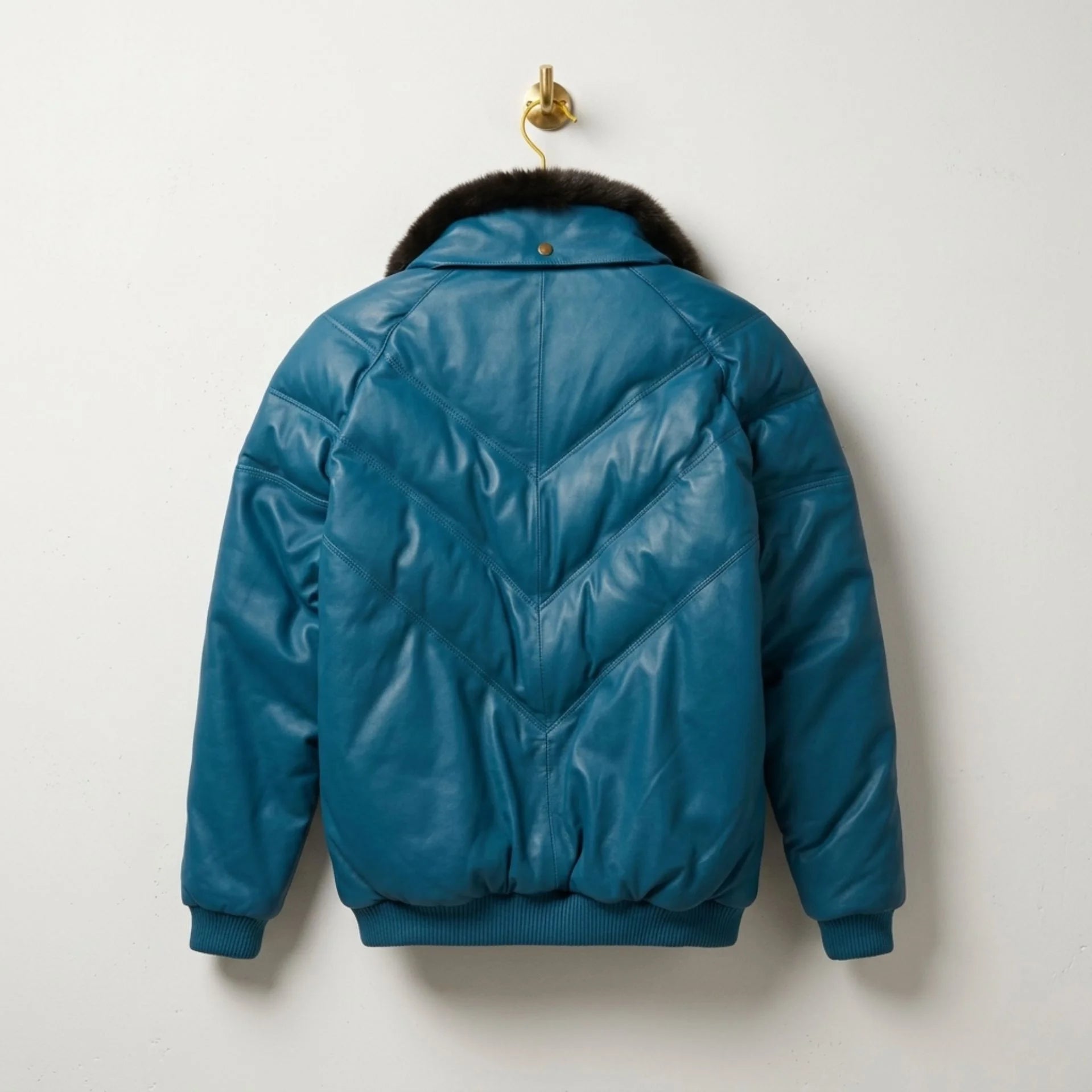 Back view of premium men's teal leather V-bomber jacket quilted design