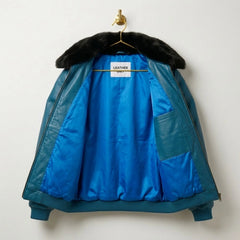 Interior blue lining and Leather Unit label in teal leather bomber jacket
