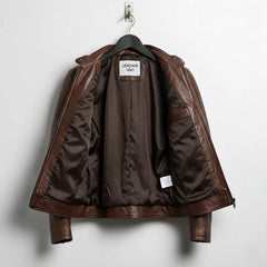 interior of men's brown leather biker jacket showing brown lining and inside pocket.