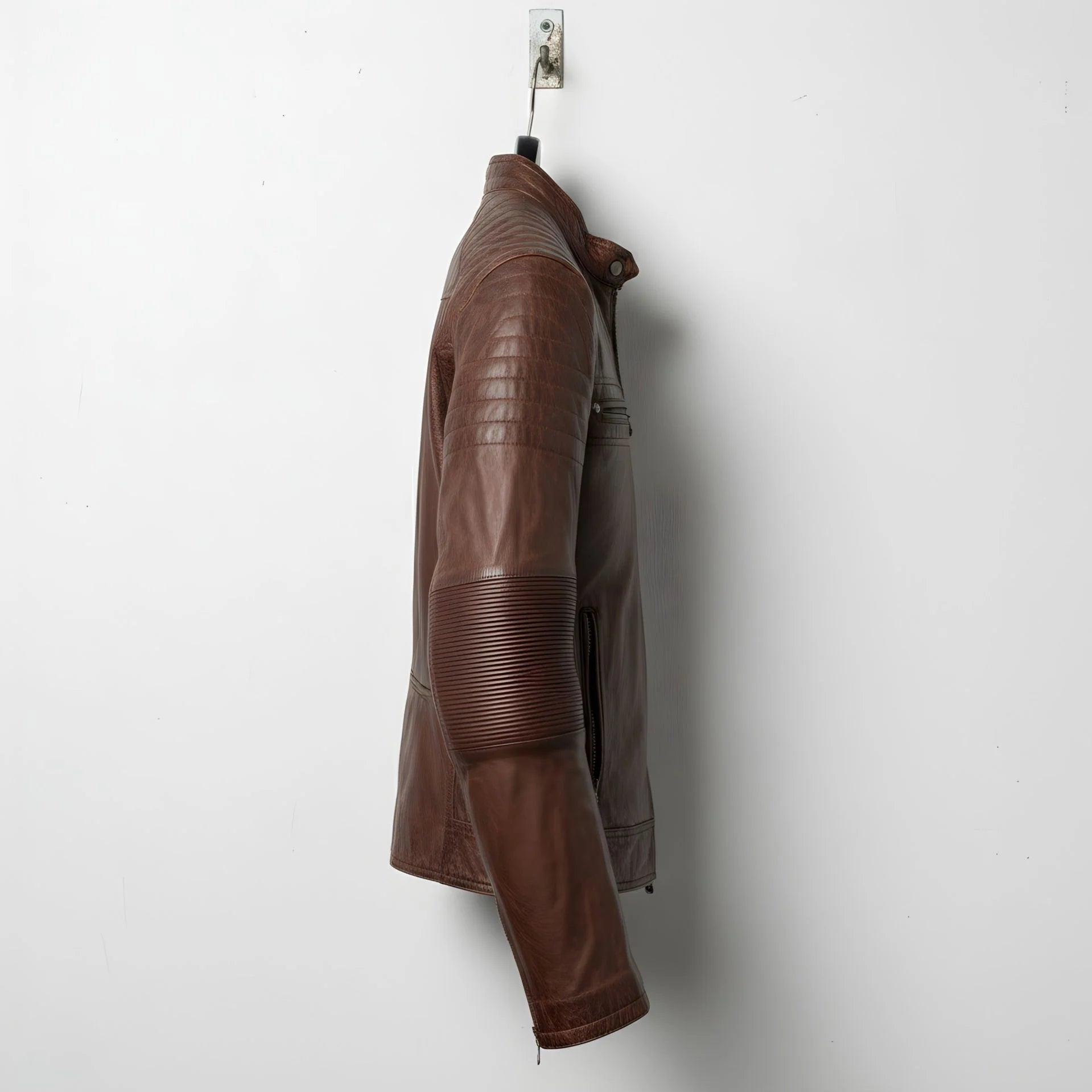 side profile of men's vintage brown cafe racer jacket with quilted shoulder.