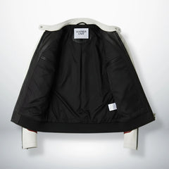 interior of men's white and black leather jacket showing black lining and inside pockets.