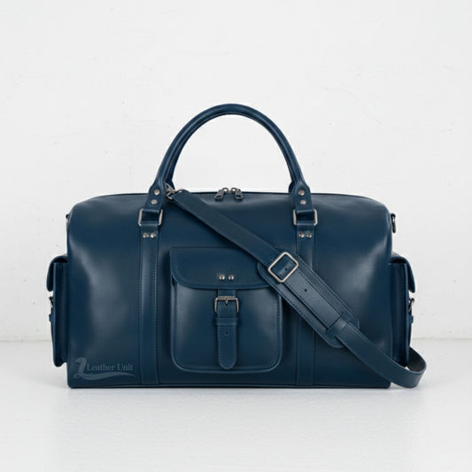 front view navy leather duffle bag with buckle pocket and shoulder strap by Leather Unit.