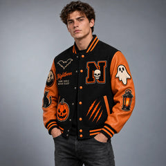 Three-quarter front view of Nightborn varsity jacket highlighting orange leather sleeves, ghost and lantern patches