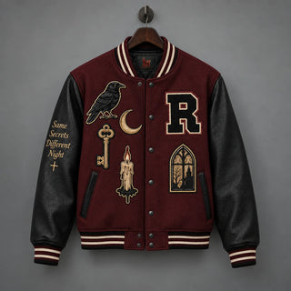 Front hanging view of Raven Manor varsity jacket with black leather sleeves, raven patch and gothic window design