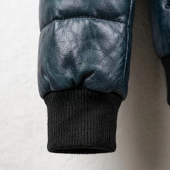Detailed view of ribbed cuff on genuine lambskin puffer bomber jacket