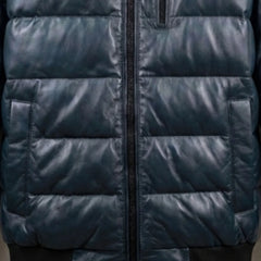 Close-up of chest zip pocket and quilted texture on teal leather bomber jacket