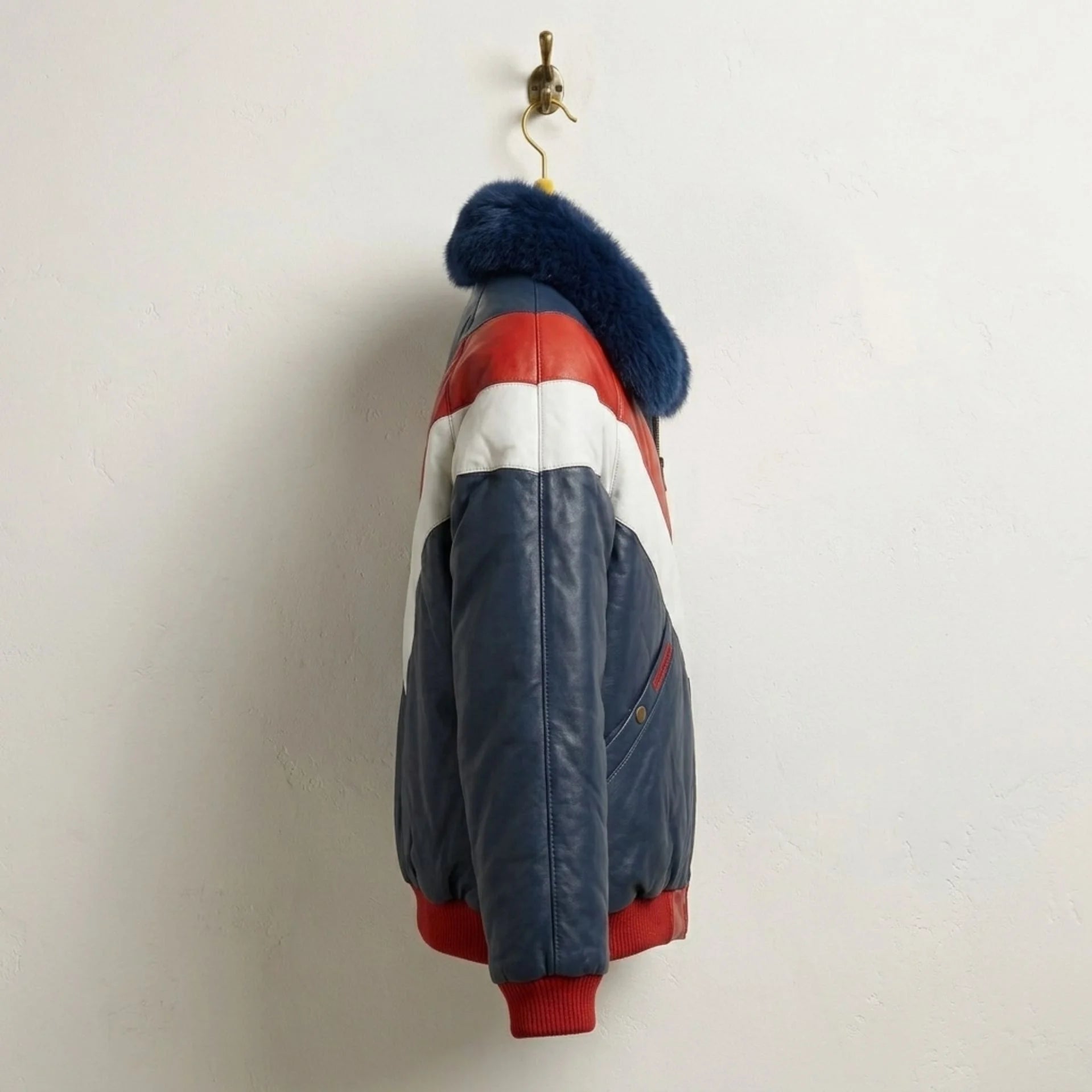Side profile of Men's Red White Blue Leather Puffer Jacket with Navy Fur Collar
