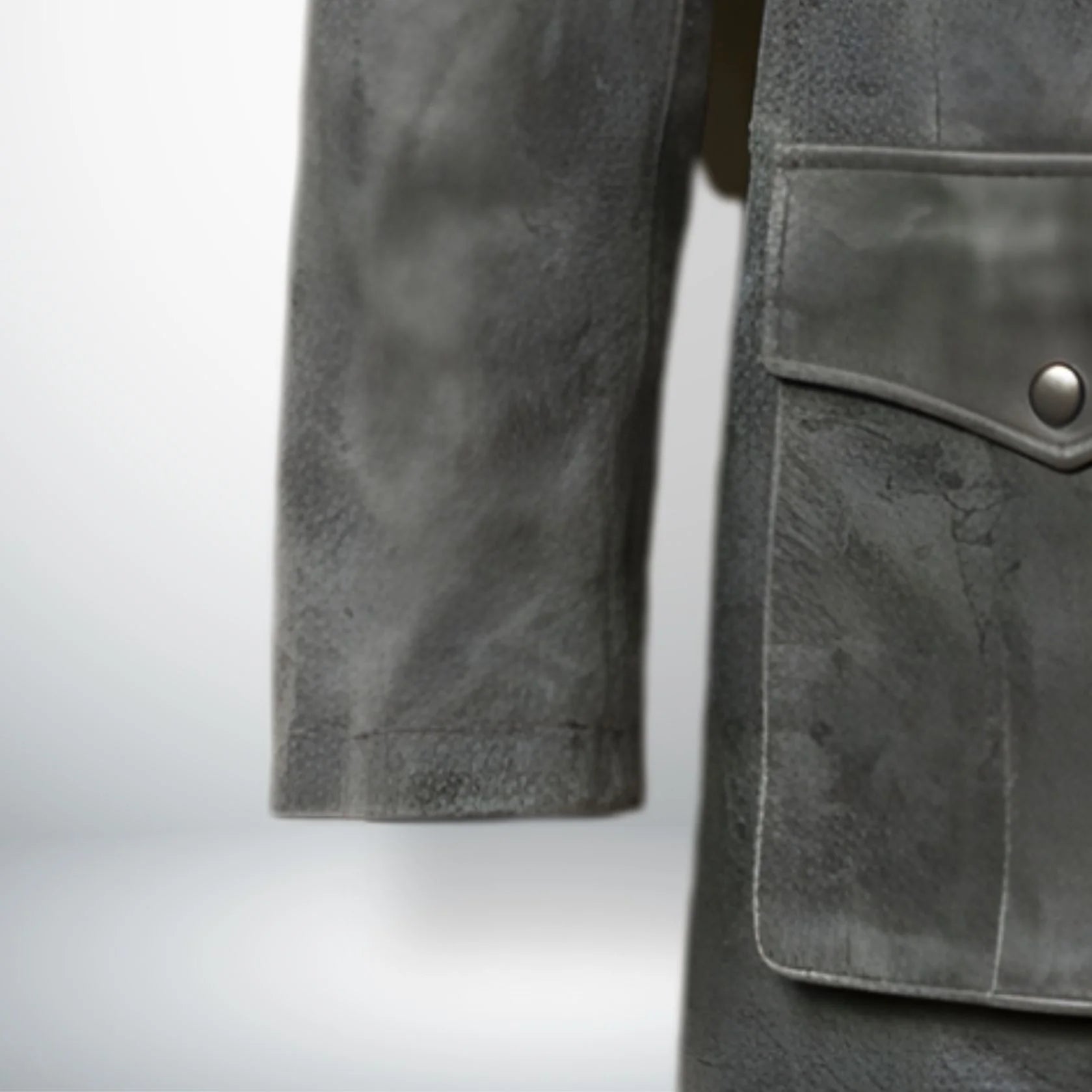 close up sleeve and hem detail on mens vintage grey leather coat.