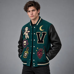 Three-quarter model view showing embroidered teal varsity jacket, black leather sleeves and striped rib-knit trim