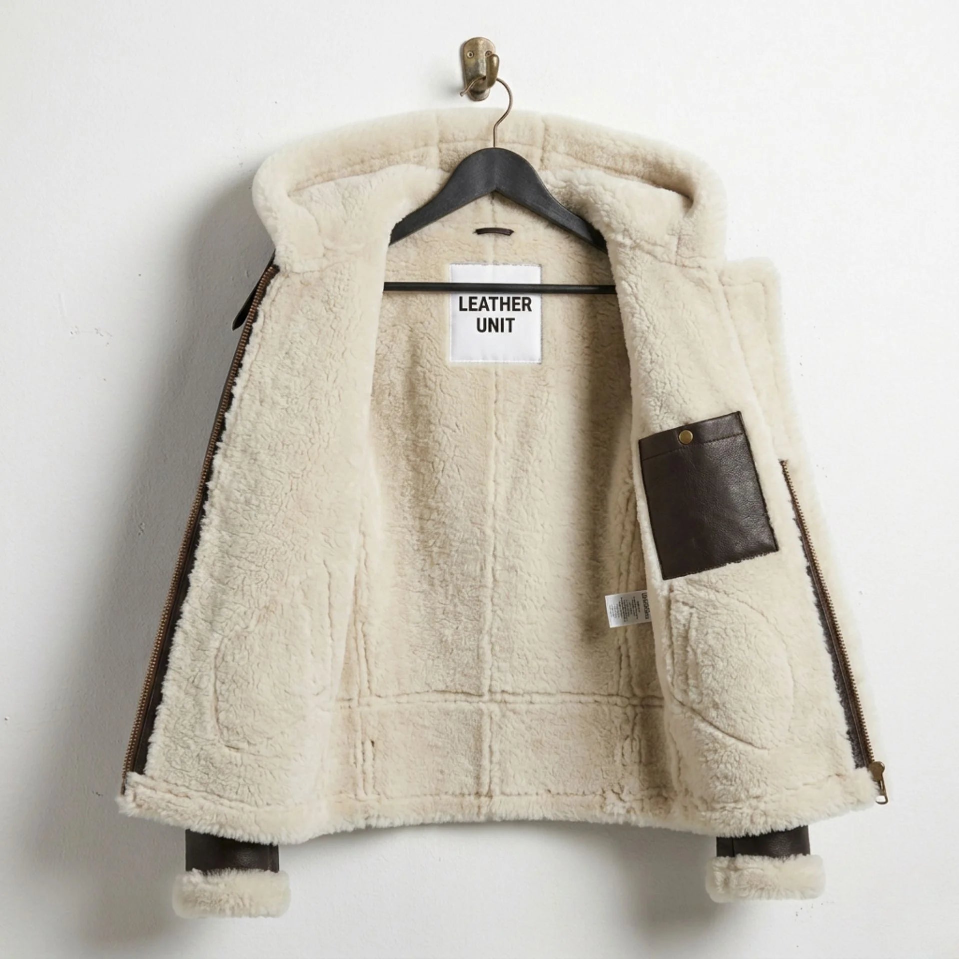 Inside view of women’s B3 aviator jacket showing full cream shearling lining and interior pocket