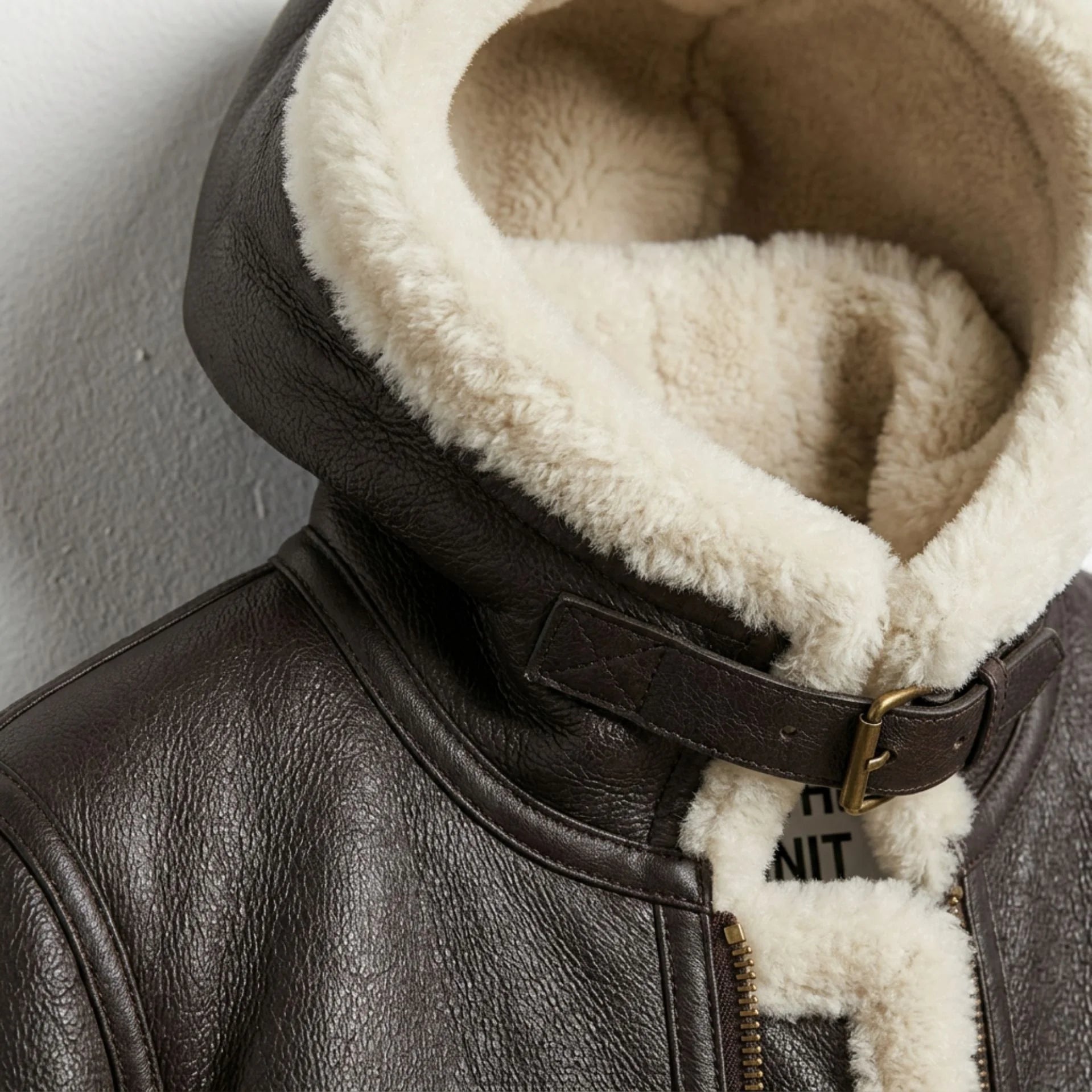 Close up of hood and collar buckle on women’s brown B3 shearling aviator jacket