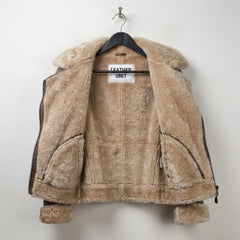 Inside view showing full beige shearling lining on women’s B3 leather jacket