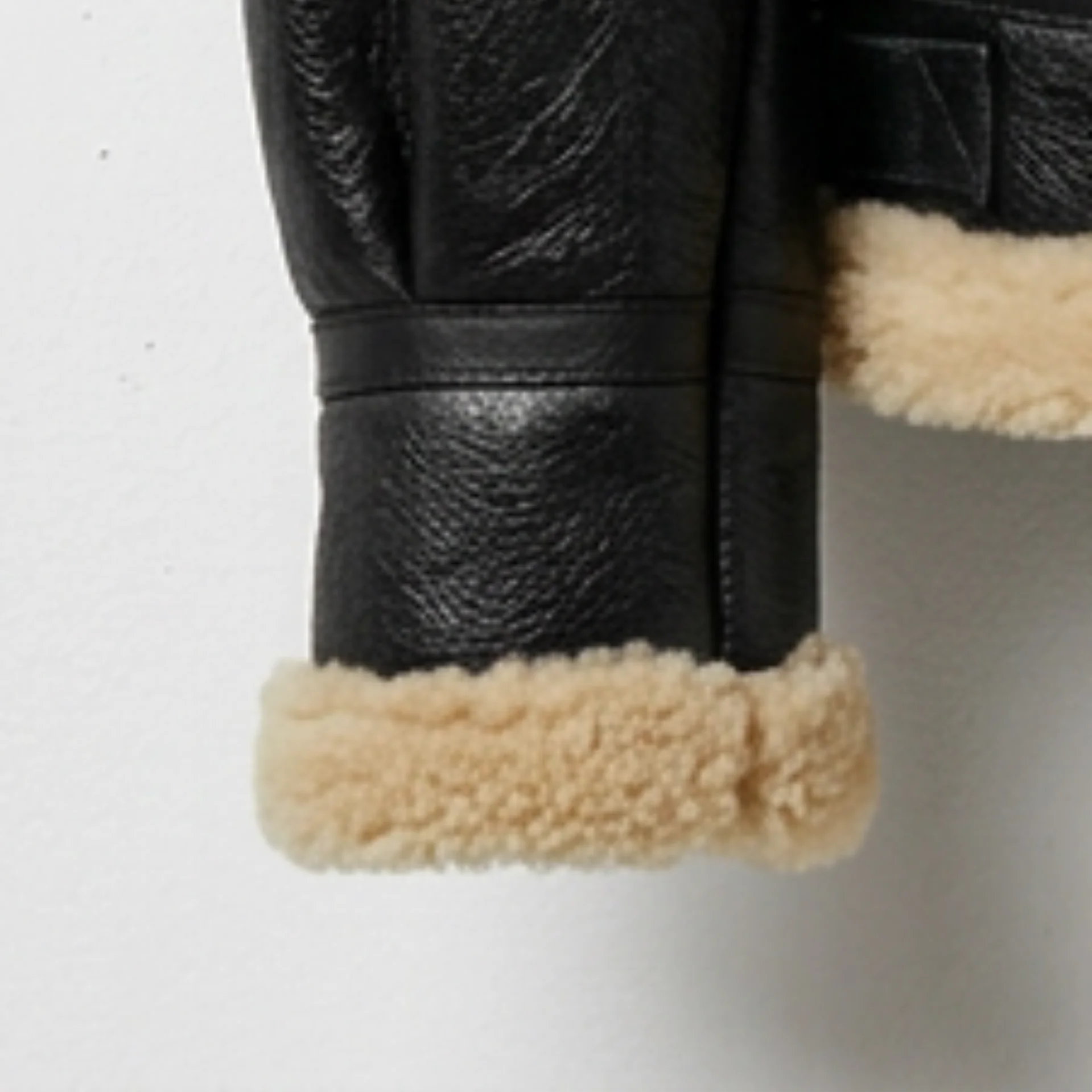 Women’s black aviator shearling leather jacket with cuff fur trim