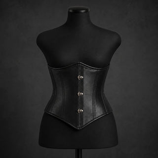 Front mannequin view of women’s black leather underbust corset with steel-boned panels and pointed centre hem.