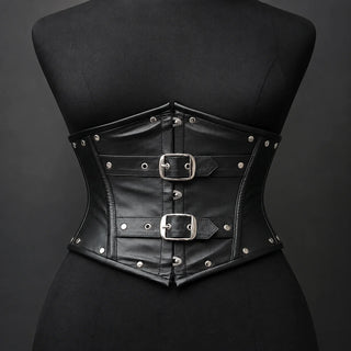 Front product view of black cowhide underbust corset with twin buckle straps, studs and curved structured waist shape.
