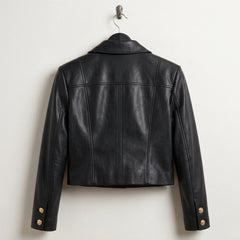 Back view of women’s cropped black leather military jacket