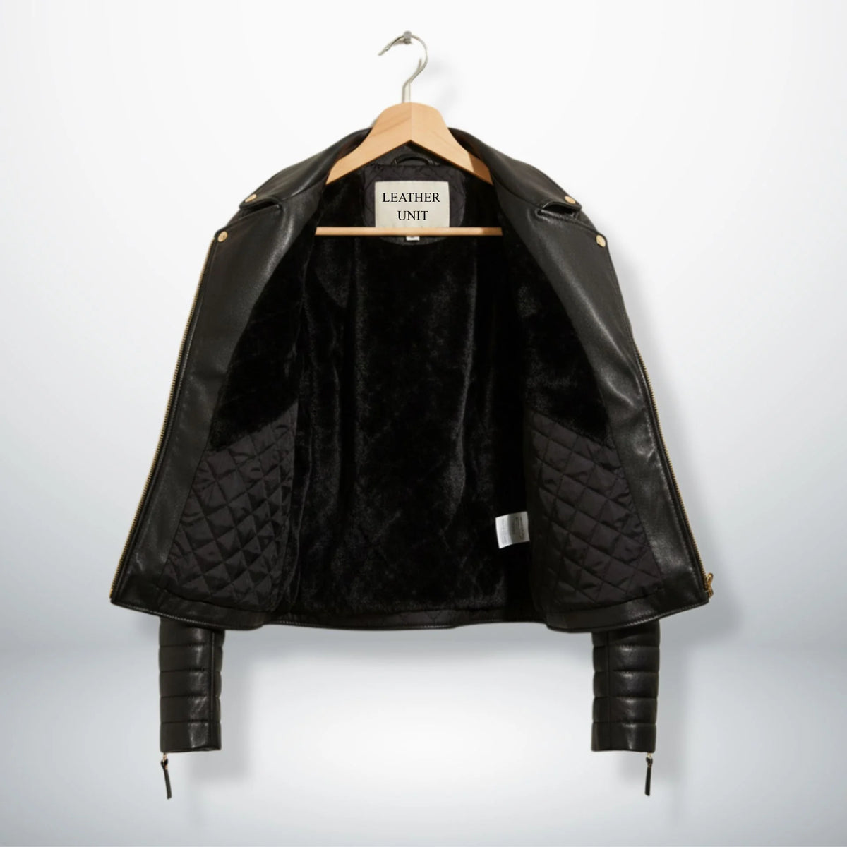 inside view womens black leather jacket with faux fur and quilted lining.