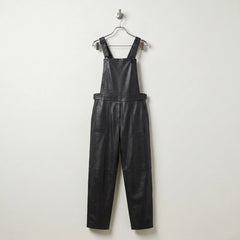 Front view of women’s black leather overalls with bib and tapered legs
