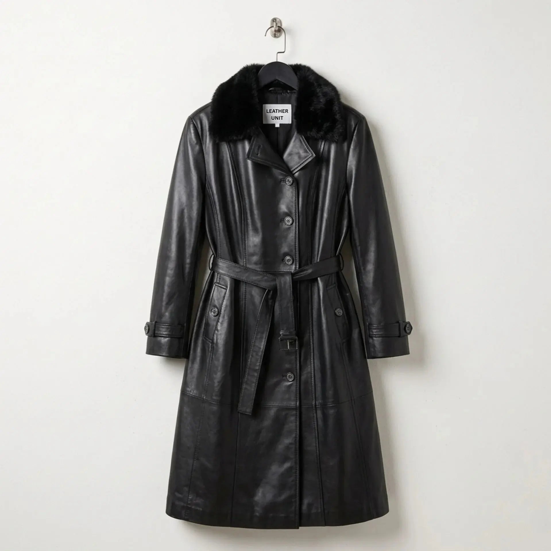 Front view of women’s black leather trench coat with faux fur collar and belt by Leather Unit