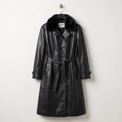 Front view of women’s black leather trench coat with faux fur collar and belt by Leather Unit