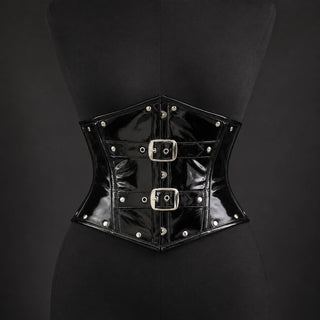 Front mannequin view of black PVC underbust corset with two square buckles, silver-tone studs and structured panels.