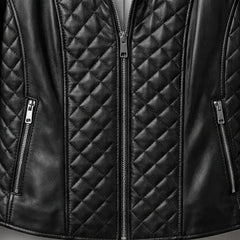 Zipper pocket detail on women’s black quilted leather jacket