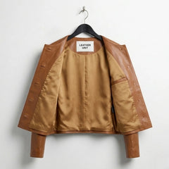 Inside lining of women’s brown collarless leather jacket with inner pocket