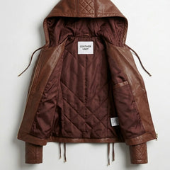 Inside view of women’s brown hooded moto leather jacket showing quilted lining and interior pocket detail.