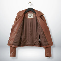 interior of women's brown leather moto jacket showing satin lining.