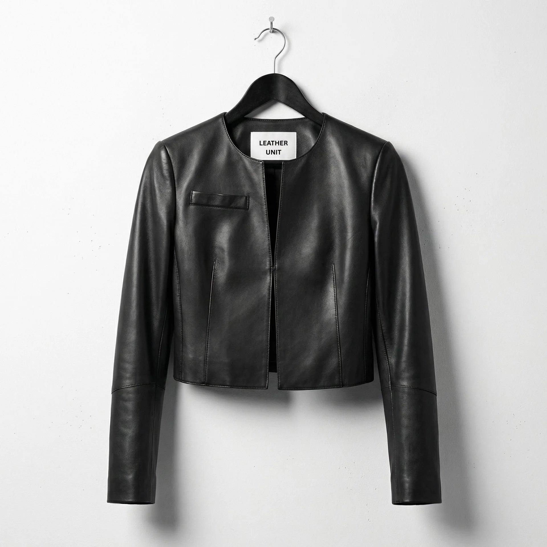 Front view of women's cropped black leather jacket with round neck by Leather Unit