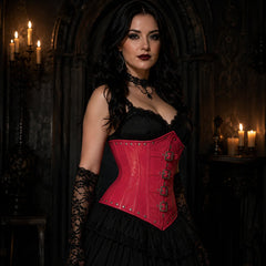 Three-quarter model view of pink steel boned PVC corset with buckle straps, rivets and high-shine finish