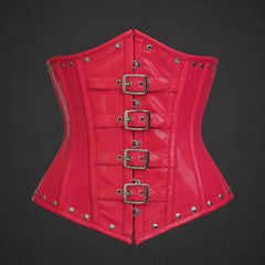 Front studio view of glossy pink PVC underbust corset with four silver-tone buckle straps and rivet trim