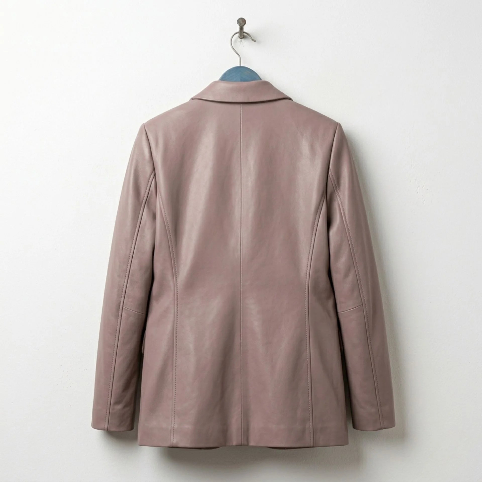 Back view of women’s taupe leather blazer showing tailored seams