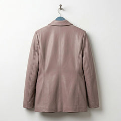 Back view of women’s taupe leather blazer showing tailored seams