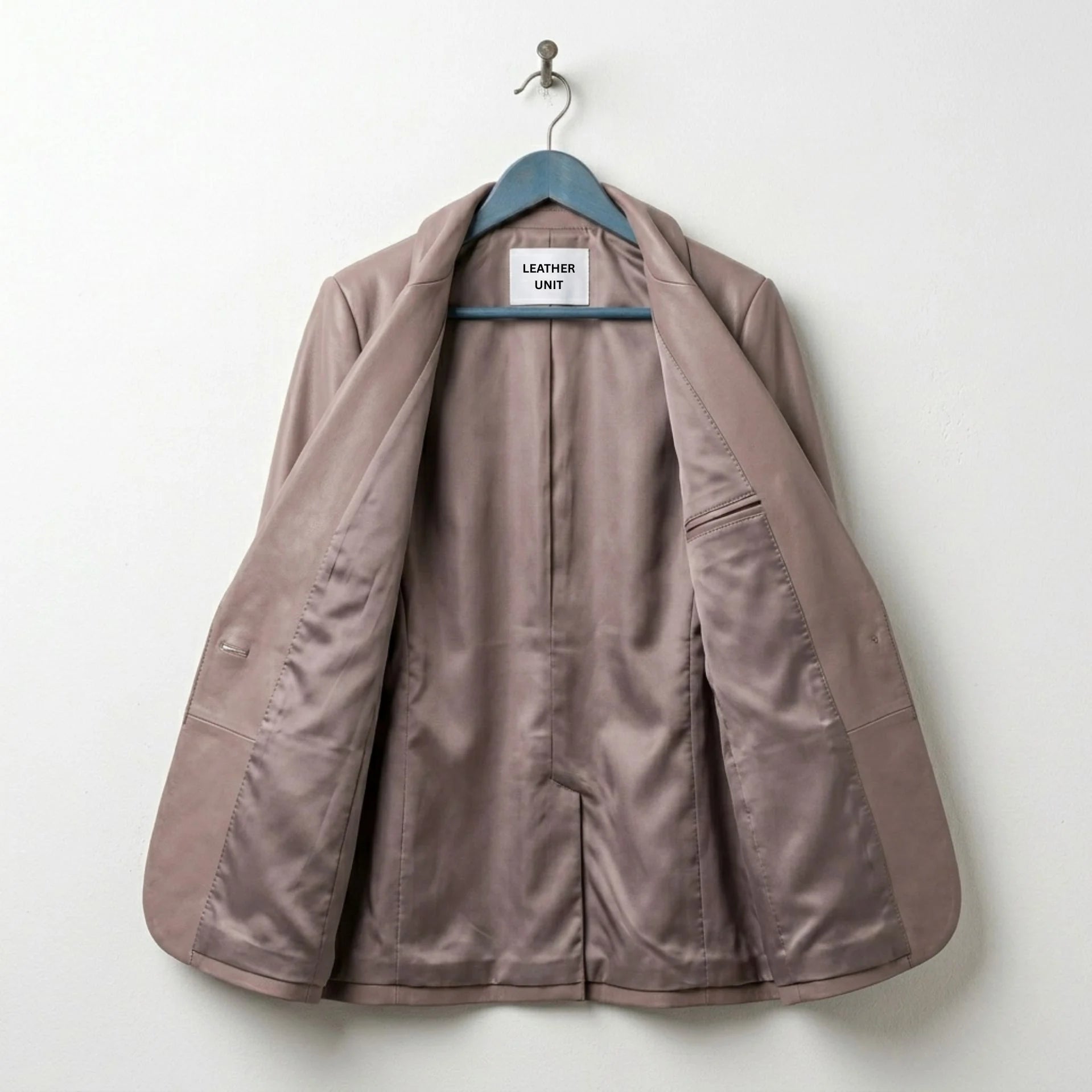Inside view of women’s taupe leather blazer with full satin lining