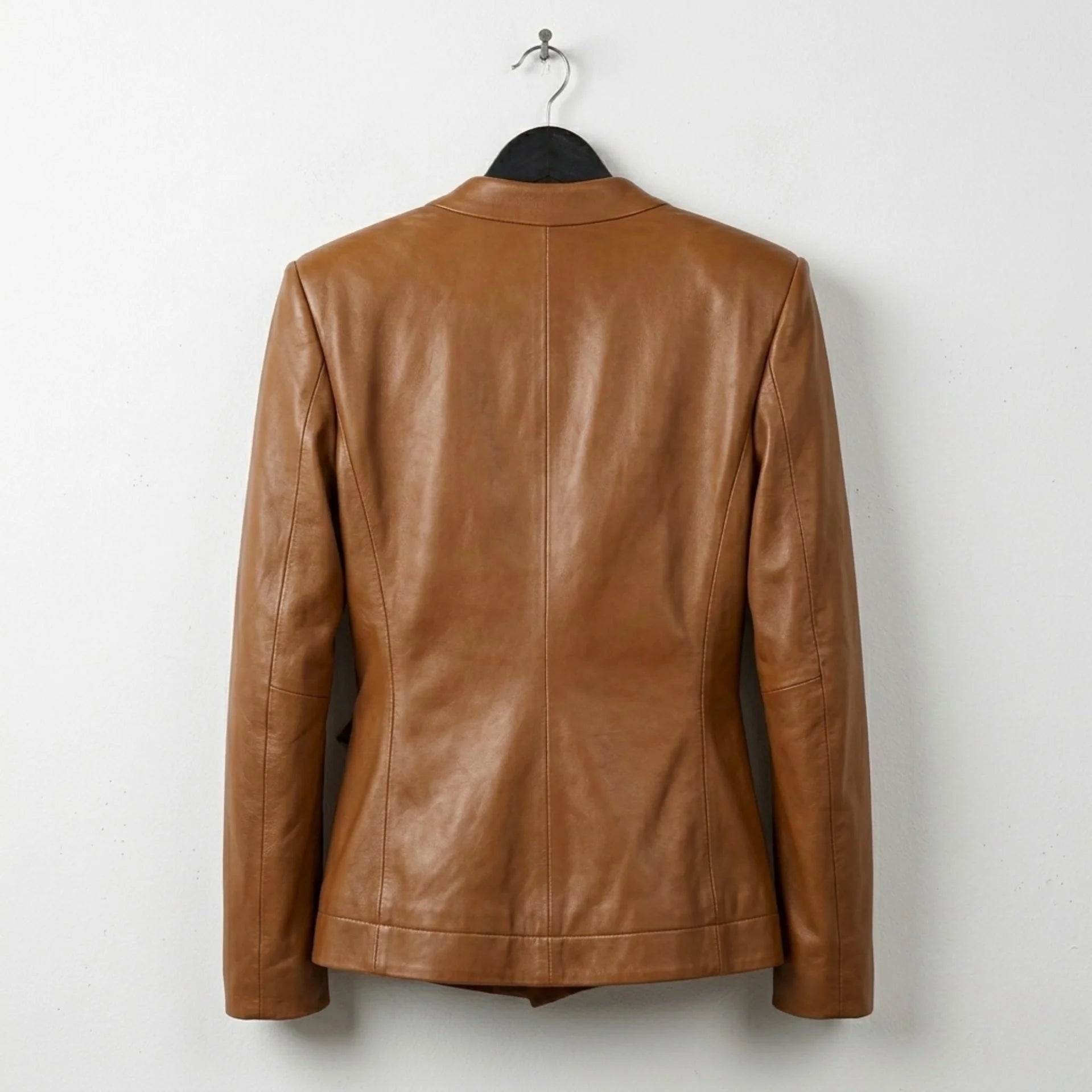 Back view of tailored caramel brown leather jacket for women
