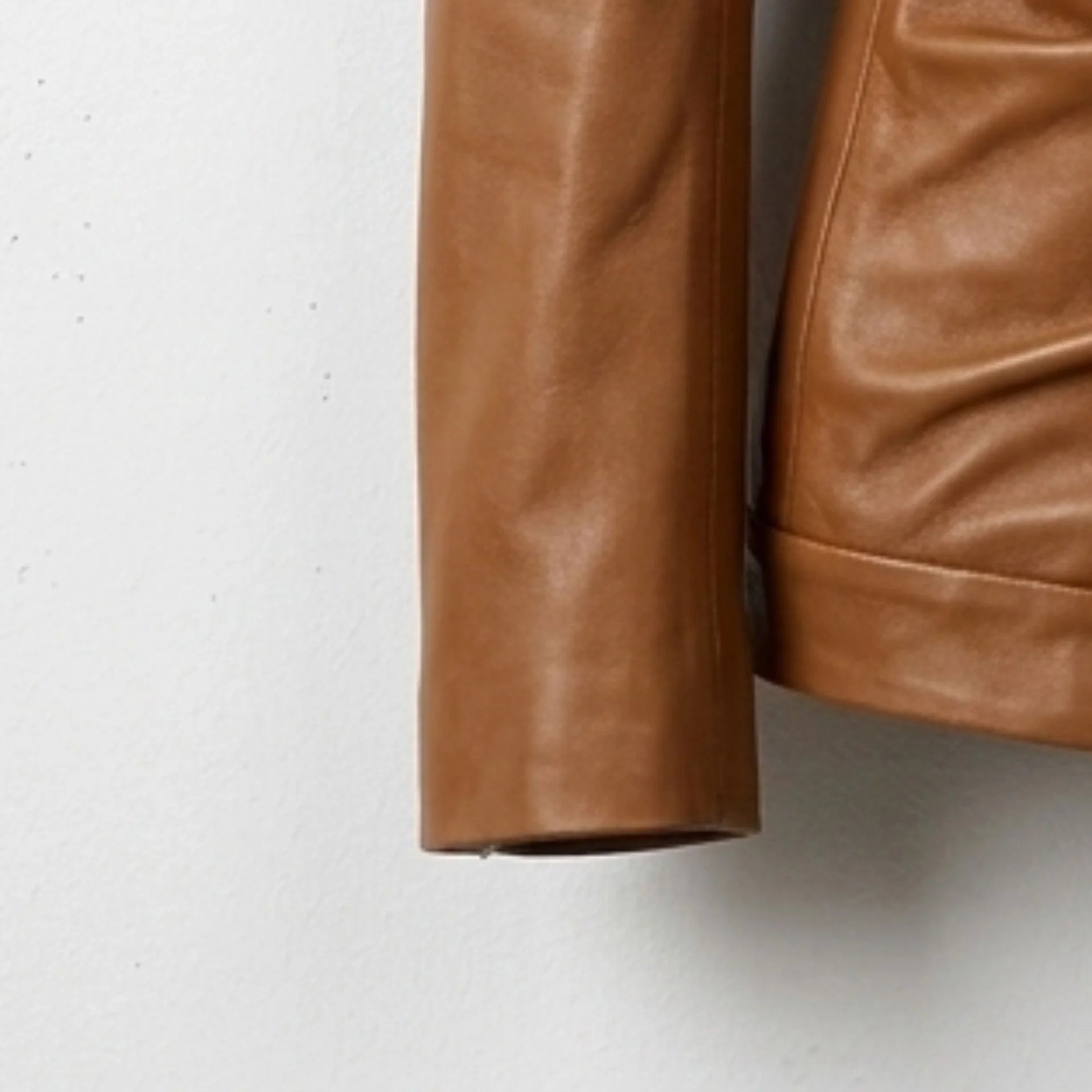 Long sleeve and cuff detail on womens caramel brown leather jacket
