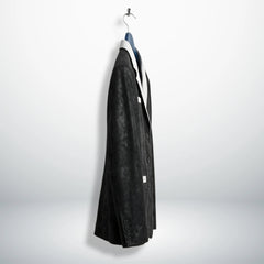 Side profile of men’s black leather blazer with white lapel