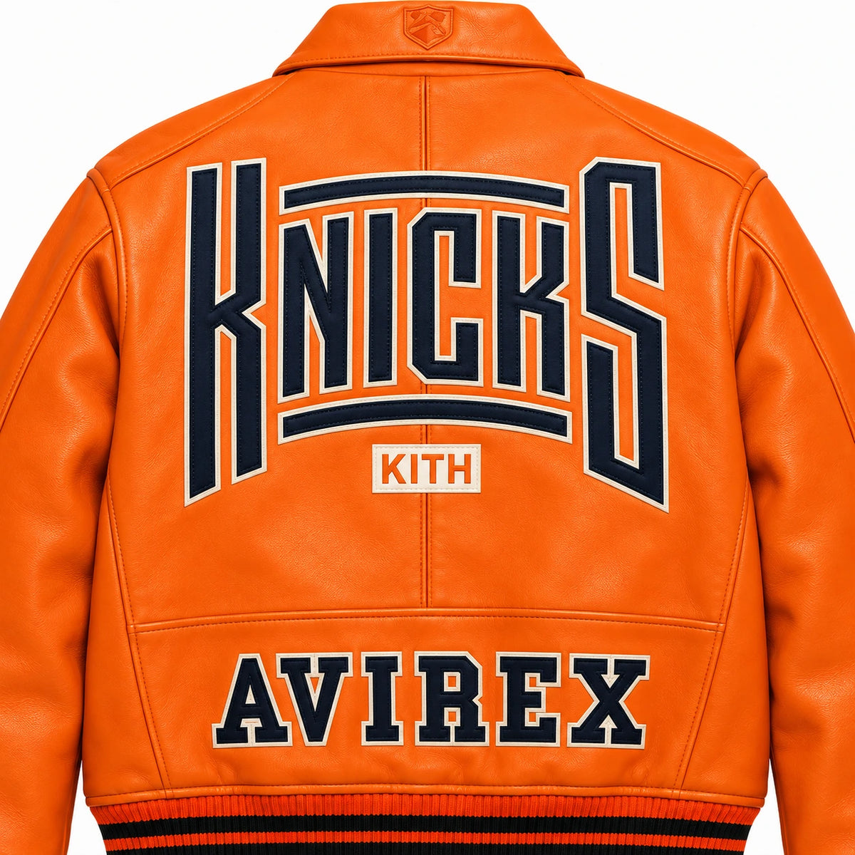Close-up back view of orange leather bomber showing oversized Knicks graphic with Kith and Avirex lettering
