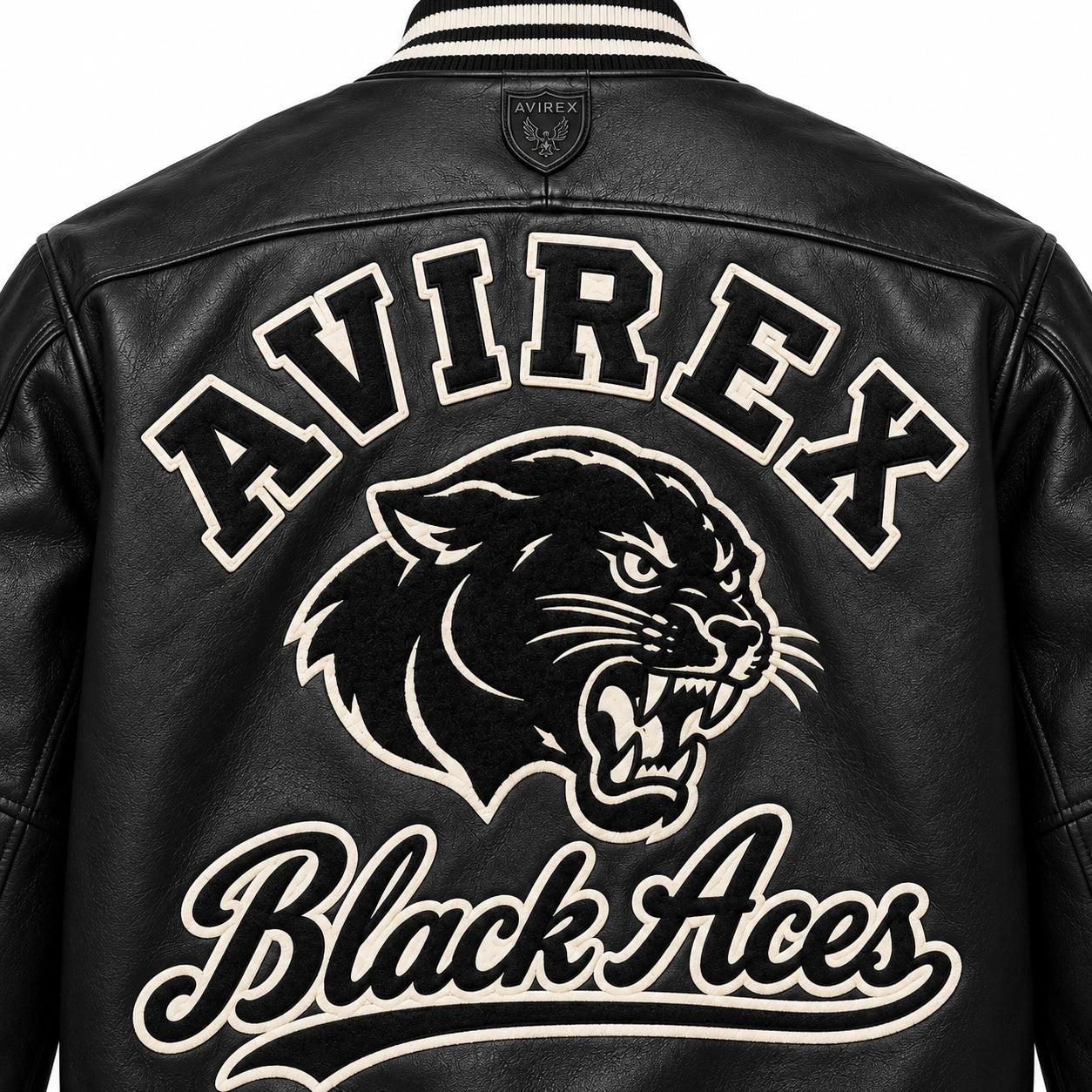 Close-up back view of Avirex Black Aces leather jacket showing oversized AVIREX lettering, panther graphic and cream script