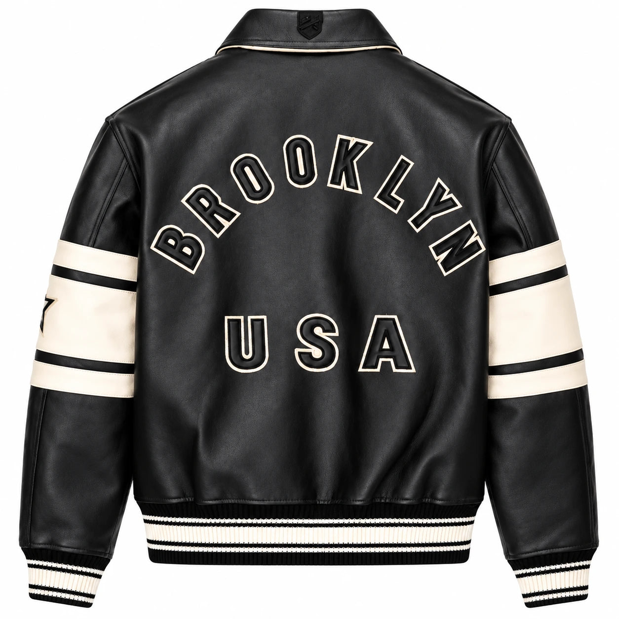 Full back view of Avirex men’s black leather bomber featuring large BROOKLYN USA lettering and cream sleeve panels