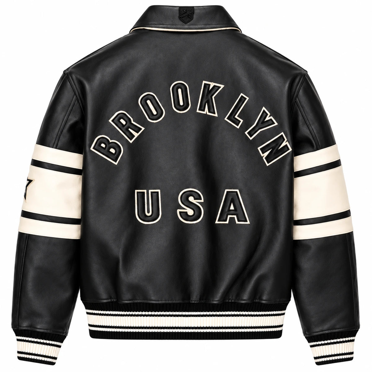 Full back view of Avirex men’s black leather bomber featuring large BROOKLYN USA lettering and cream sleeve panels
