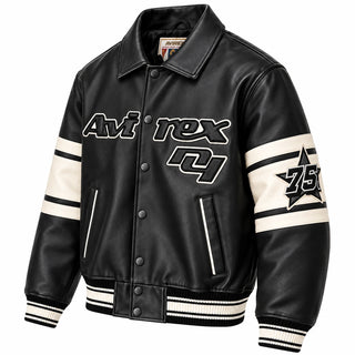 Three-quarter front view of Avirex men’s black Brooklyn leather varsity jacket with cream sleeve panels, 75 patch and snap buttons