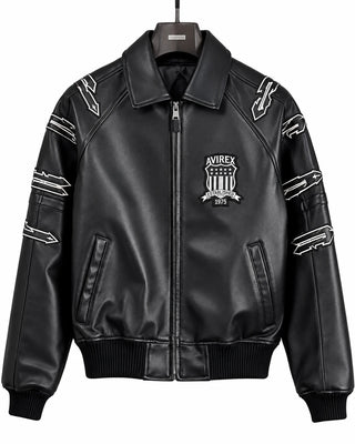 Front view of Avirex men’s black LDN leather bomber with Established 1975 chest patch, sleeve graphics and full zip