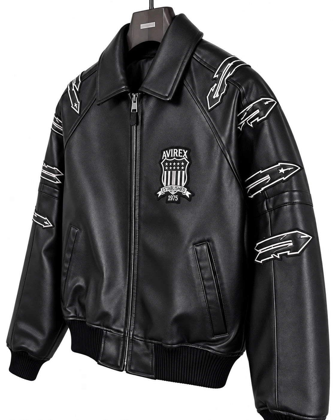 Close-up of Avirex black LDN leather jacket showing fold-down collar, chest shield patch and outlined sleeve graphics