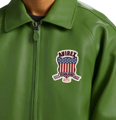 Close-up of Avirex green Icon leather jacket showing fold-down collar, front zipper and Established 1975 shield patch