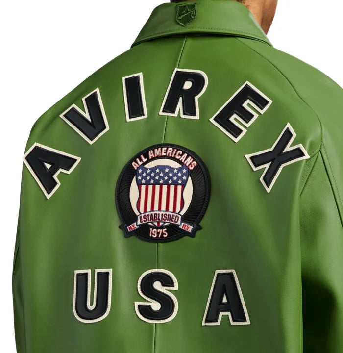 Close-up rear view of Avirex green bomber showing AVIREX appliqué, American shield crest and large USA lettering