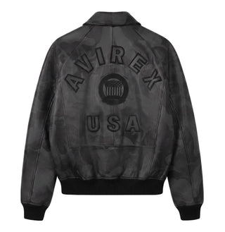 Back view of Avirex men’s grey black camo leather bomber with tonal AVIREX lettering, heritage crest and USA detail