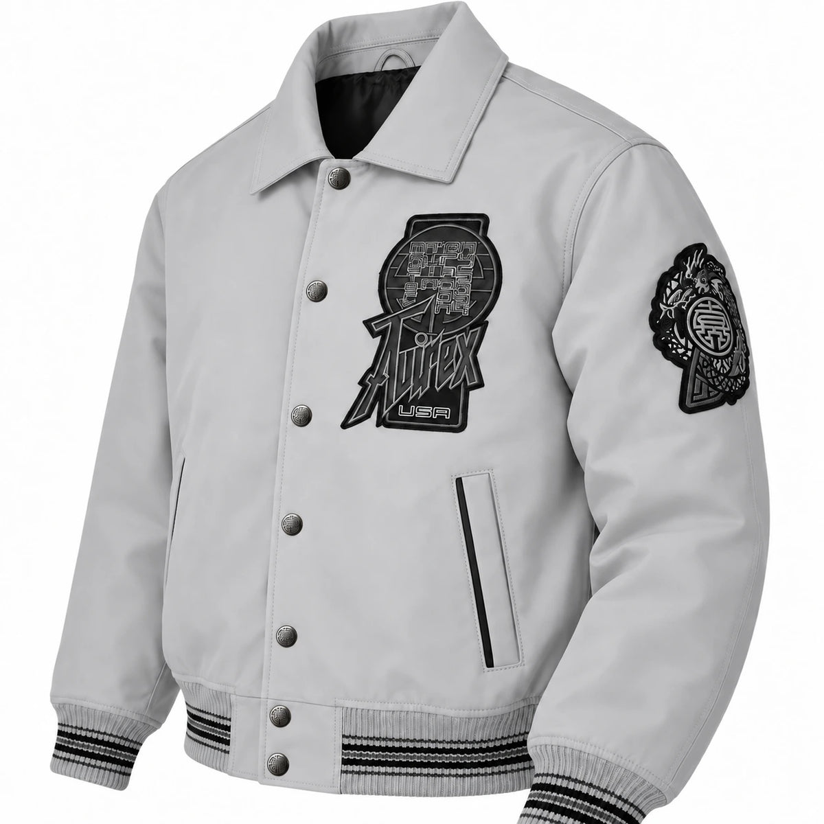 Three-quarter front view of Avirex men’s grey Twin Dragon leather jacket with snap buttons, graphic patches and striped rib trims